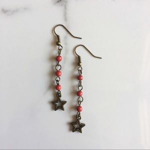 Long red star earrings